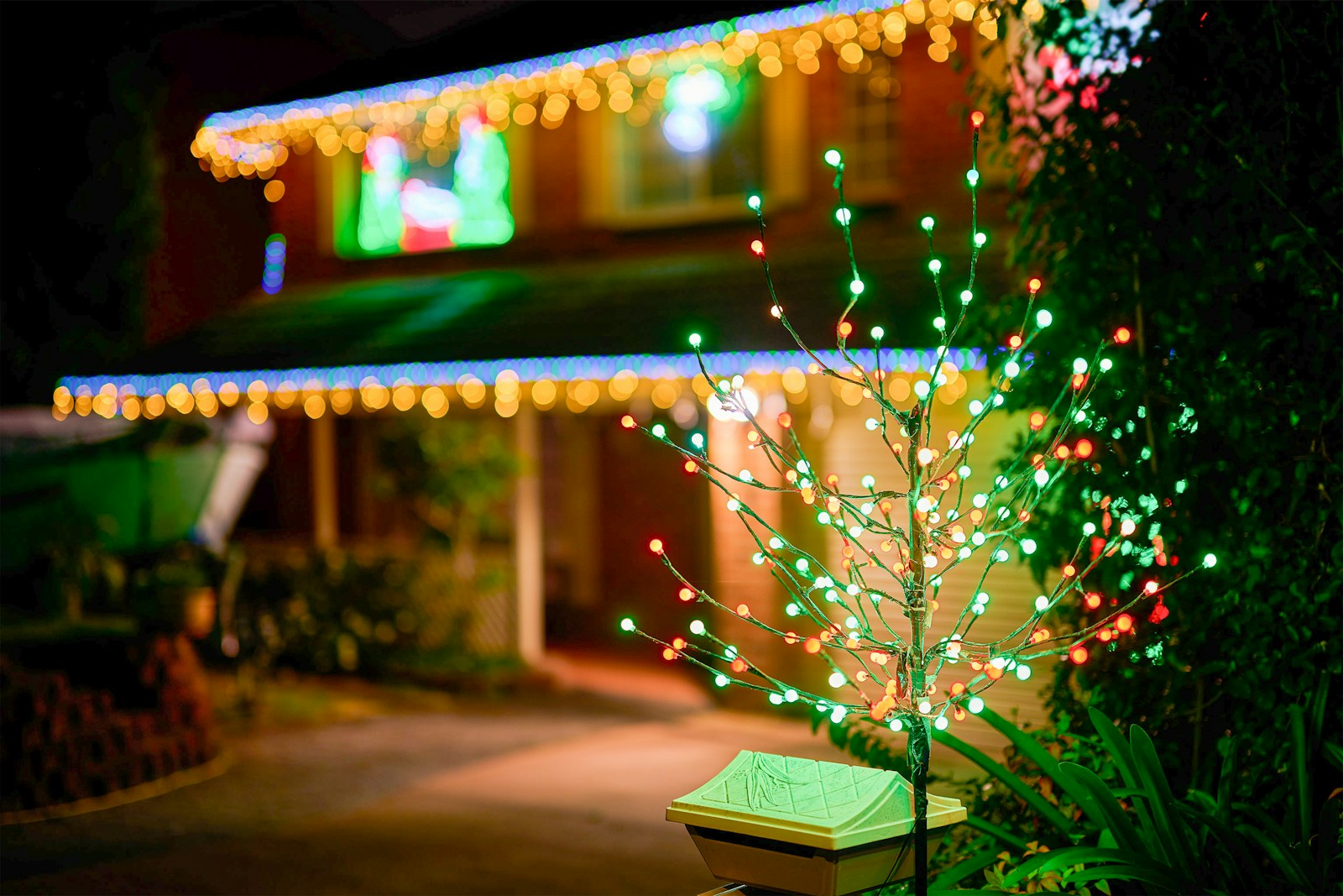 Home with warm colorful Christmas lights and bokeh at night